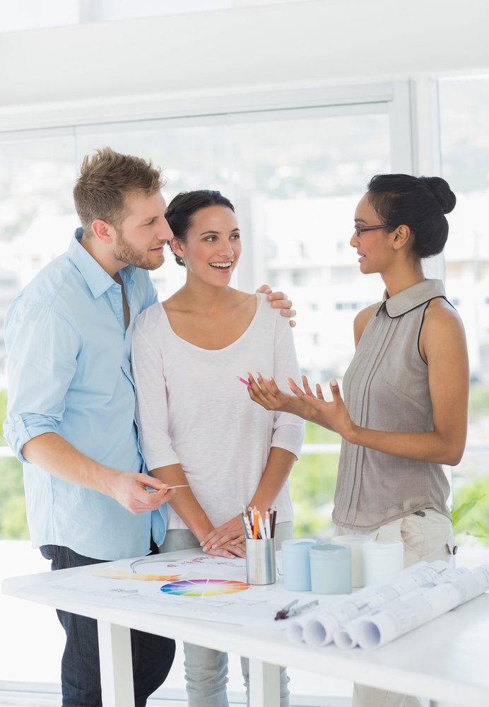 Designer reviewing inspiration and color choices with clients